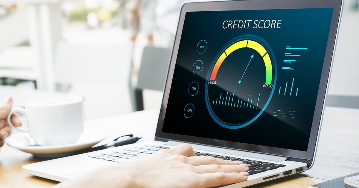 Laptop screen displaying a credit score dashboard with indicators for different score ranges, highlighting the importance of understanding and improving credit health.